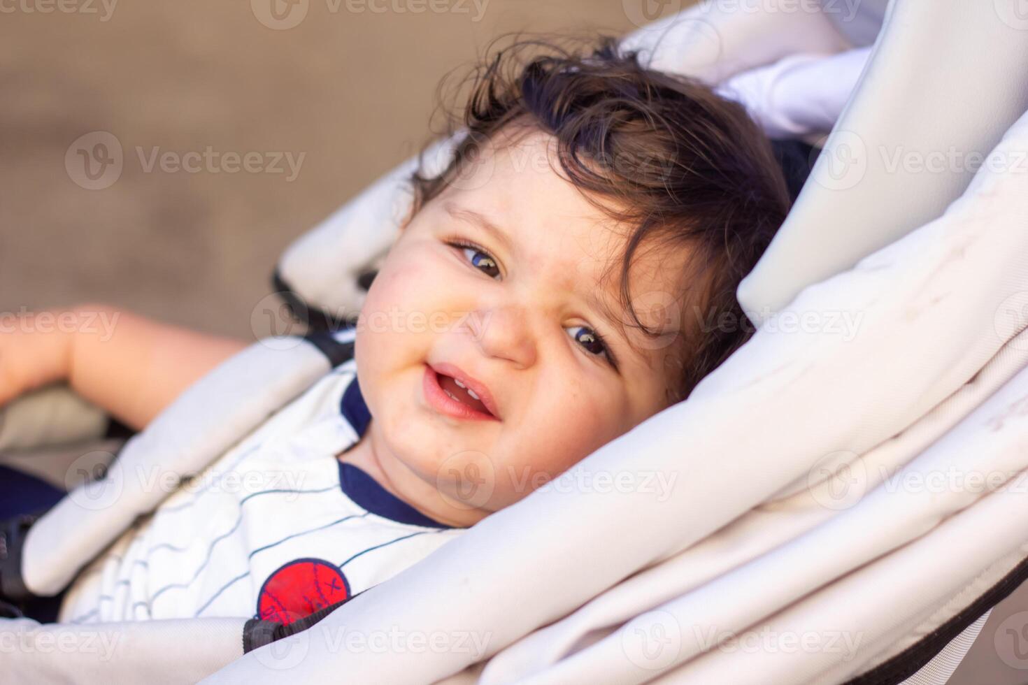 a little baby boy in a wheelchair photo