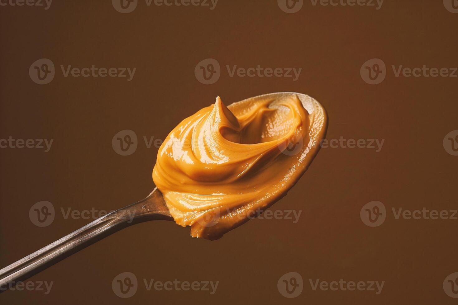 AI generated Creamy peanut butter on a spoon, close-up. photo