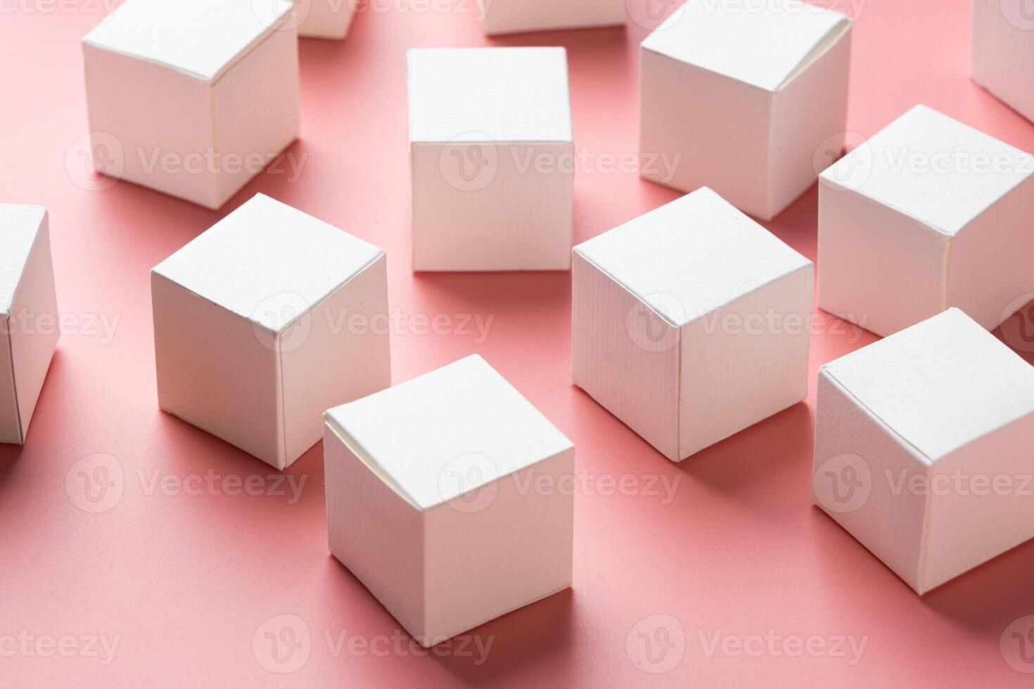 top view of colorful blank paper boxes on pink background. copy space available photo