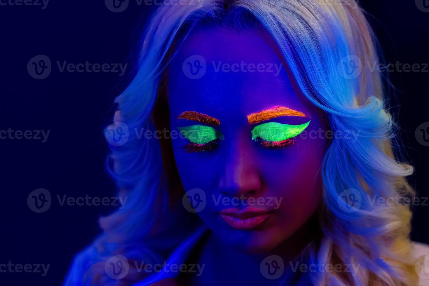 portrait of a woman with painted face, woman with uv makeup in studio, portrait of a woman in carnival mask, the woman is decorated in a ultraviolet powder photo