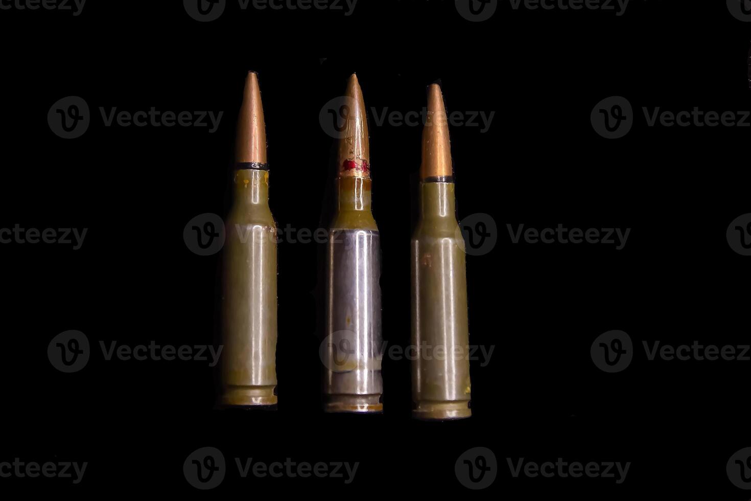 bullets on black background, bullets isolated on black, close up of bullets on black background photo