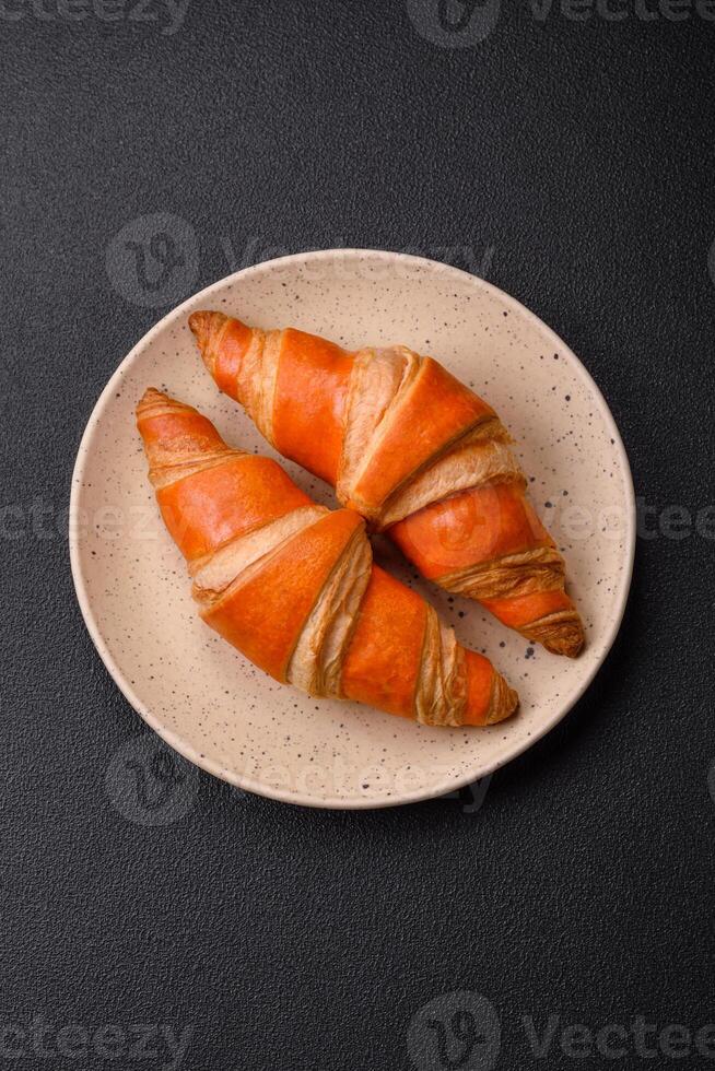 Delicious fresh, crispy French croissants with sweet filling photo