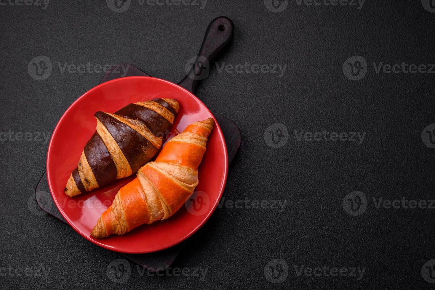 Delicious fresh, crispy French croissants with sweet filling photo