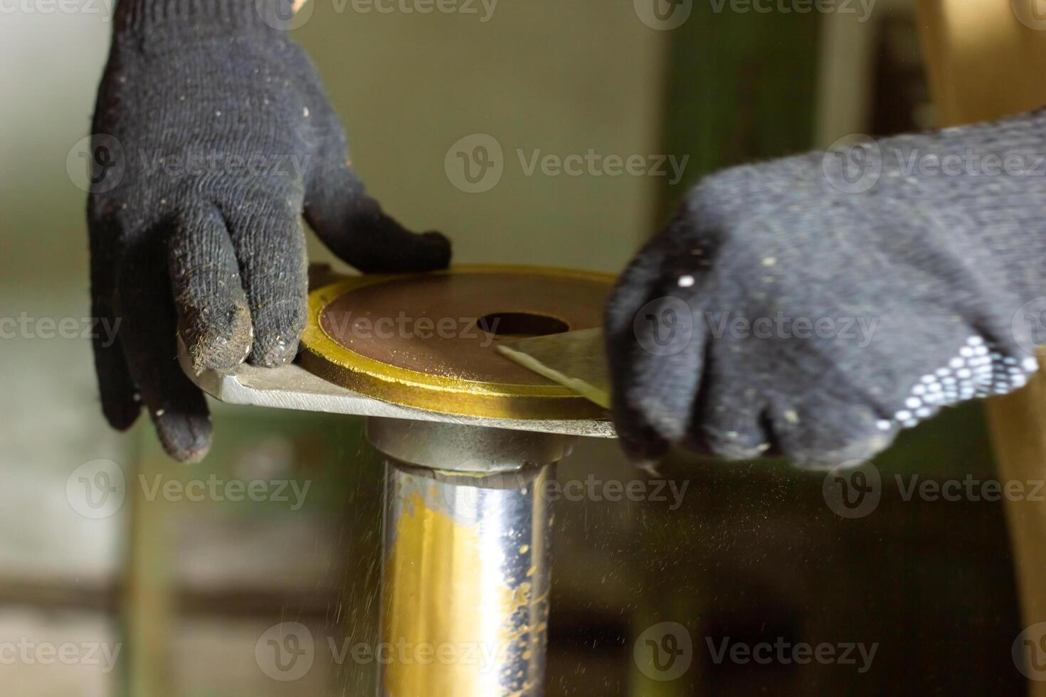 close up of a man using a machine, close up of a man working on a machine photo