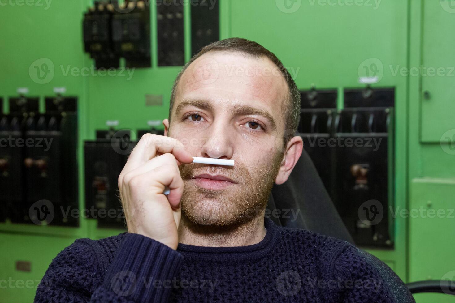 person smocking a cigarette photo