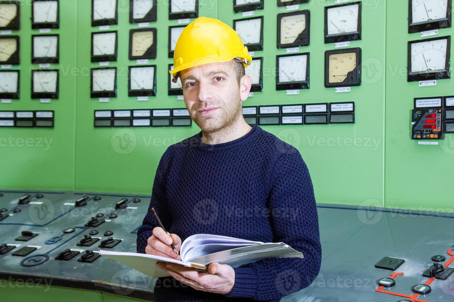 industrial worker at the work in factory photo