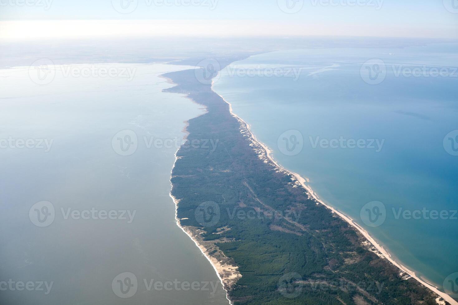 Aerial view from airplane window to Curonian spit in Kaliningrad Oblast, Russia, national park photo