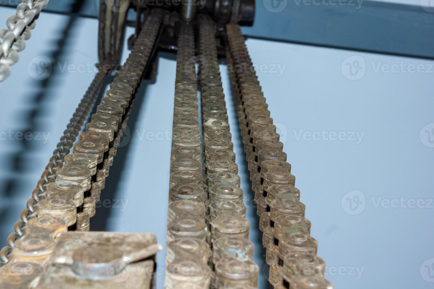 close up detail of a crane, close up of a rusty steel chain photo