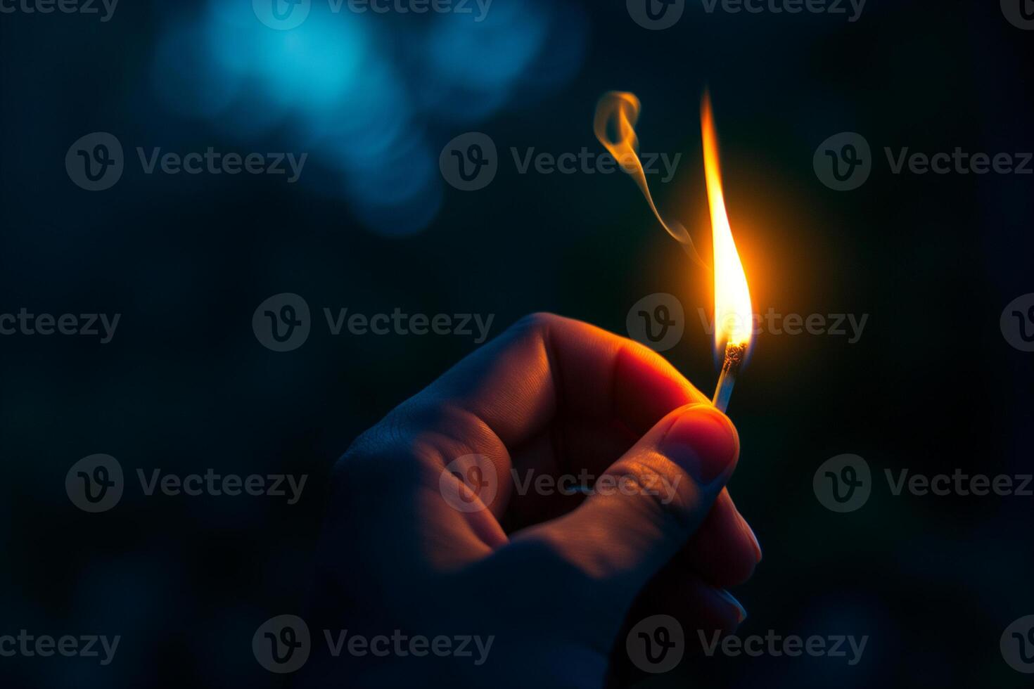 AI generated hand holds a burning match close-up on a dark background photo