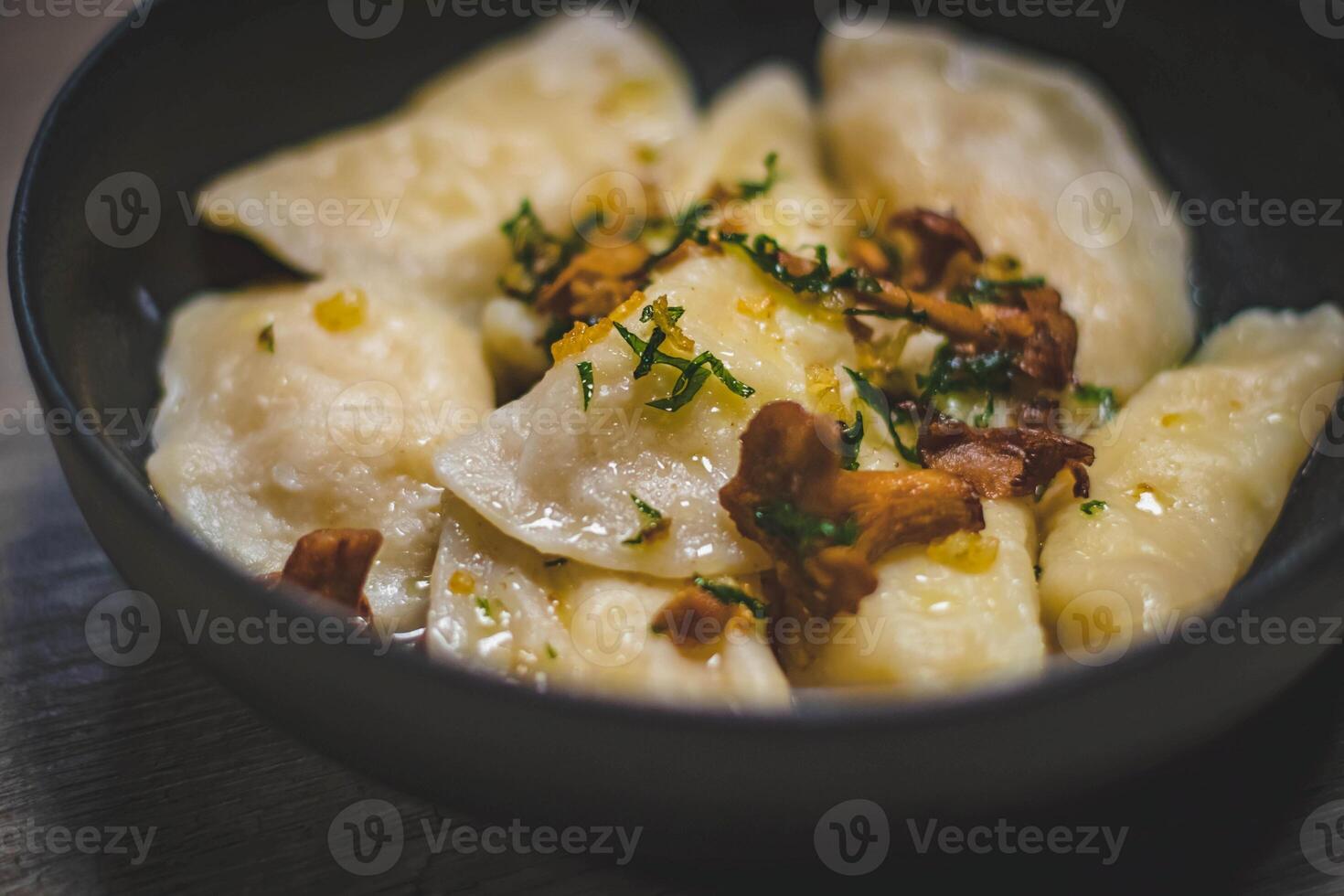 Russian dumplings vareniki with sour cream, onion and bacon photo