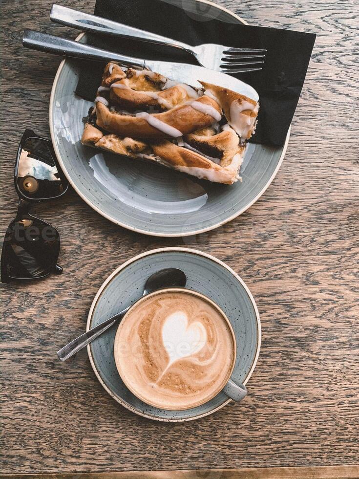 Coffee and cake on the wooden table, vintage tone. photo