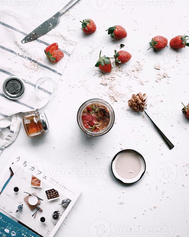 Healthy breakfast with granola and fresh berries on light background, top view photo