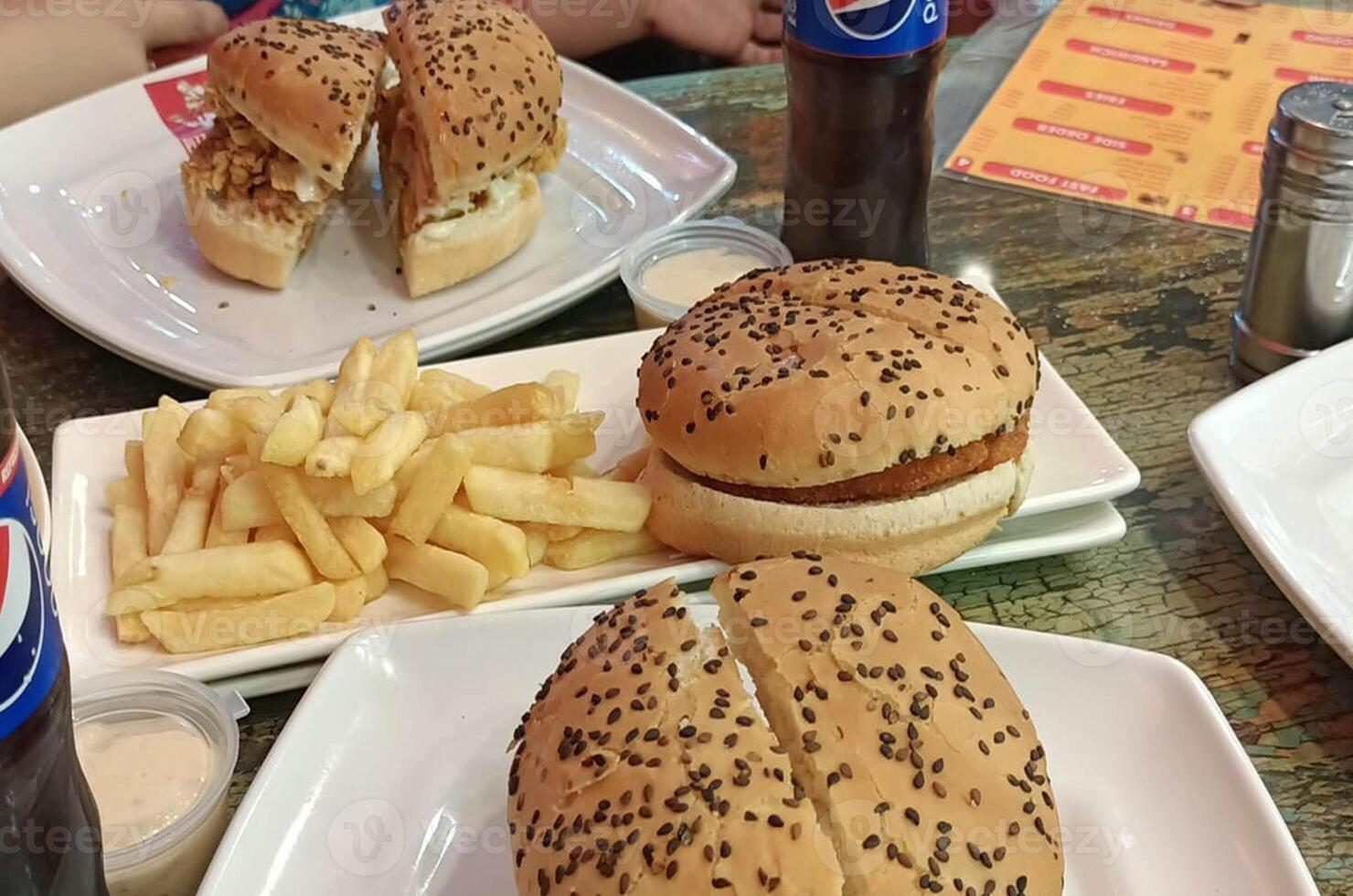 Cheese burger - American cheese burger with black sesame seeds. photo