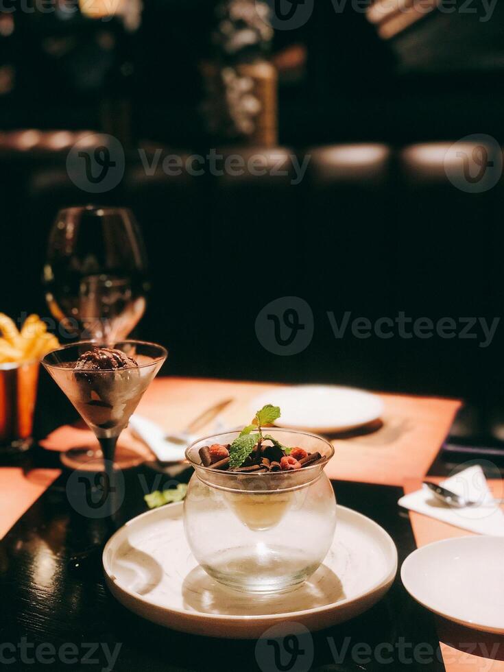 Chocolate mousse in a glass on a table in a restaurant photo