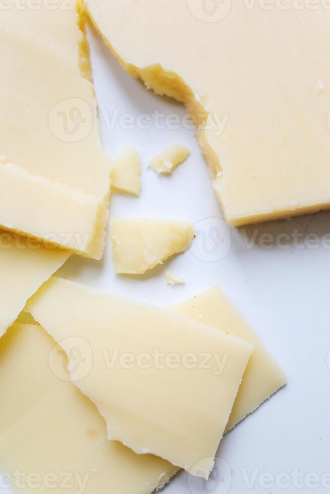 Pieces of cheese on a white background. Selective focus. photo
