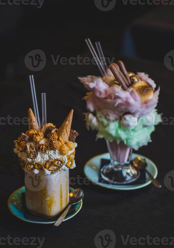 Ice cream in a glass with whipped cream and waffle cones. photo