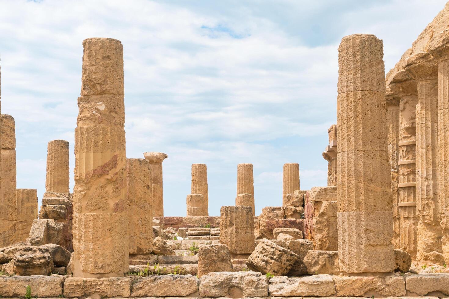 Agrigento, Italy-May 10, 2022-the imposing Greek Temple of Juno inside the Valle di Templi archaeological park near Agrigento during a sunny day photo