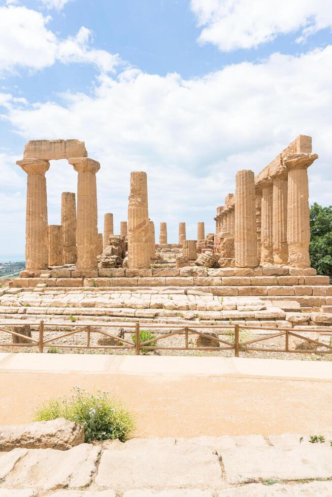 Agrigento, Italy-May 10, 2022-the imposing Greek Temple of Juno inside the Valle di Templi archaeological park near Agrigento during a sunny day photo