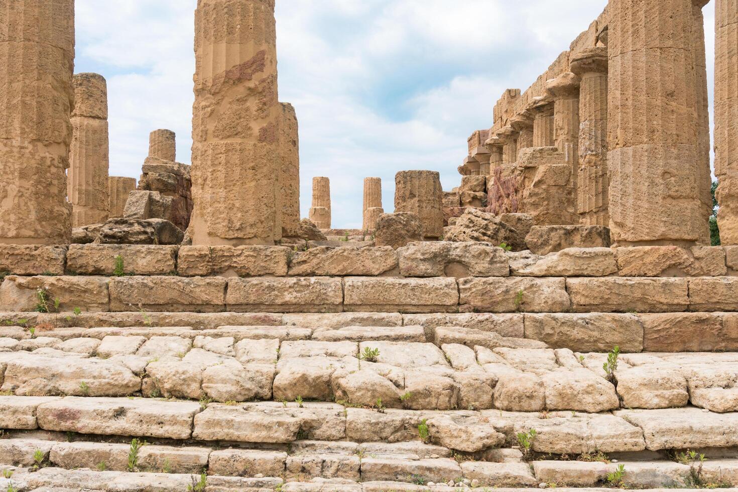 Agrigento, Italy-May 10, 2022-the imposing Greek Temple of Juno inside the Valle di Templi archaeological park near Agrigento during a sunny day photo