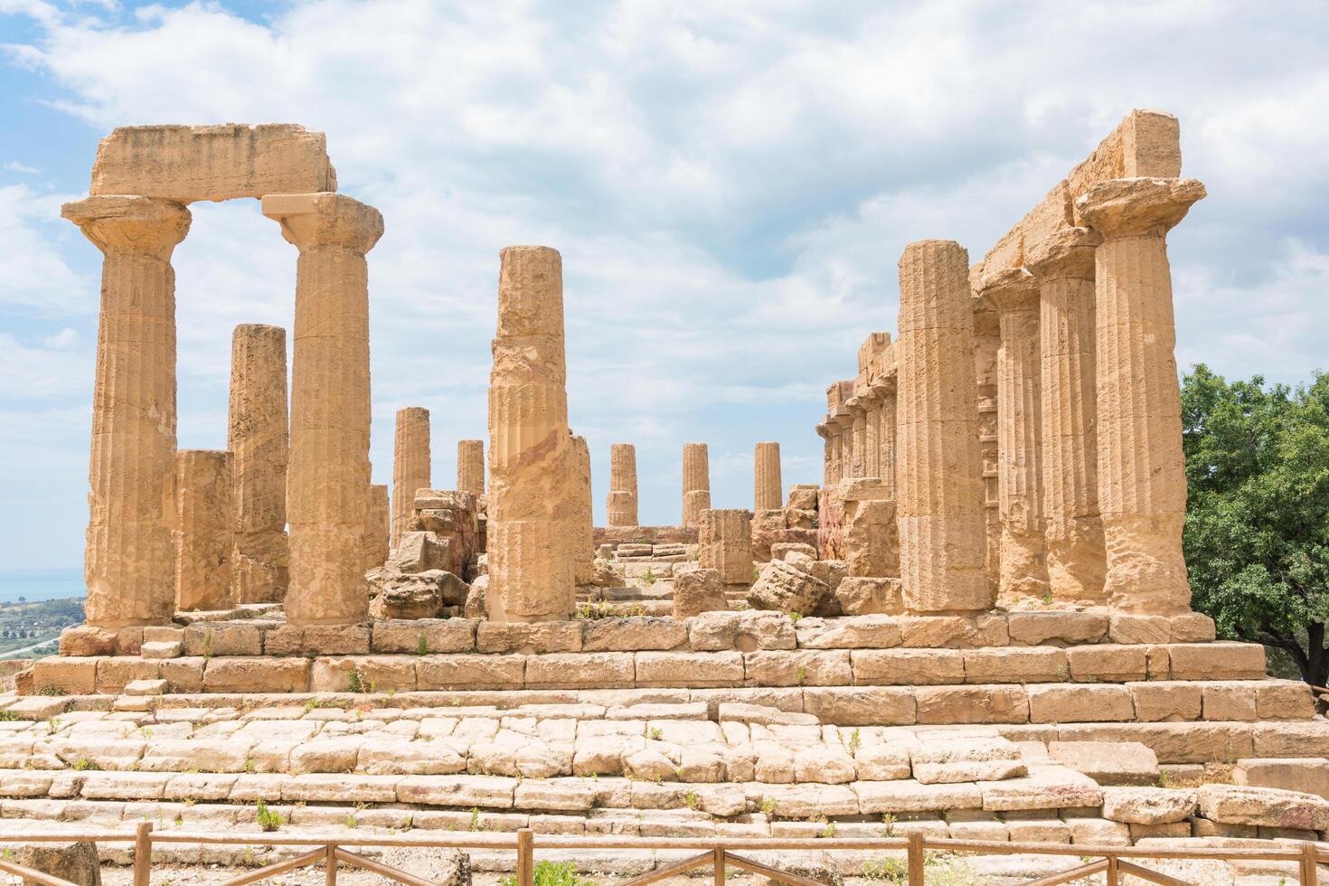 Agrigento, Italy-May 10, 2022-the imposing Greek Temple of Juno inside the Valle di Templi archaeological park near Agrigento during a sunny day photo