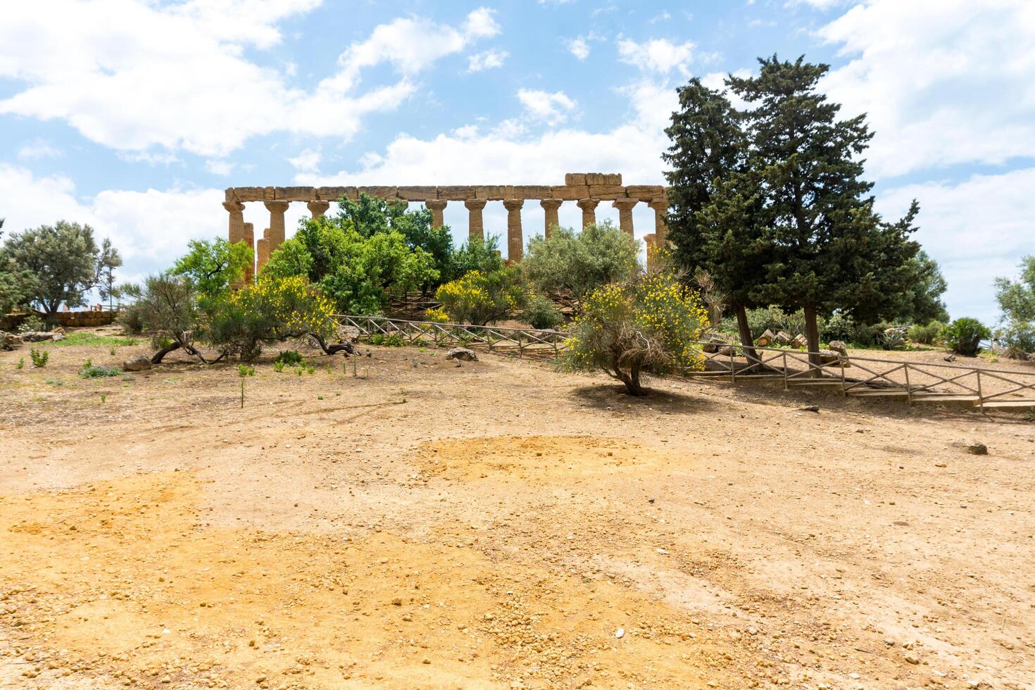 Agrigento, Italy-May 10, 2022-the imposing Greek Temple of Juno inside the Valle di Templi archaeological park near Agrigento during a sunny day photo