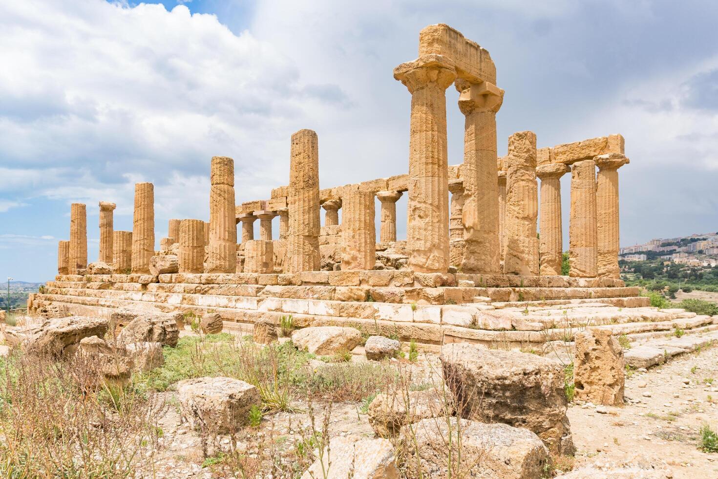 Agrigento, Italy-May 10, 2022-the imposing Greek Temple of Juno inside the Valle di Templi archaeological park near Agrigento during a sunny day photo