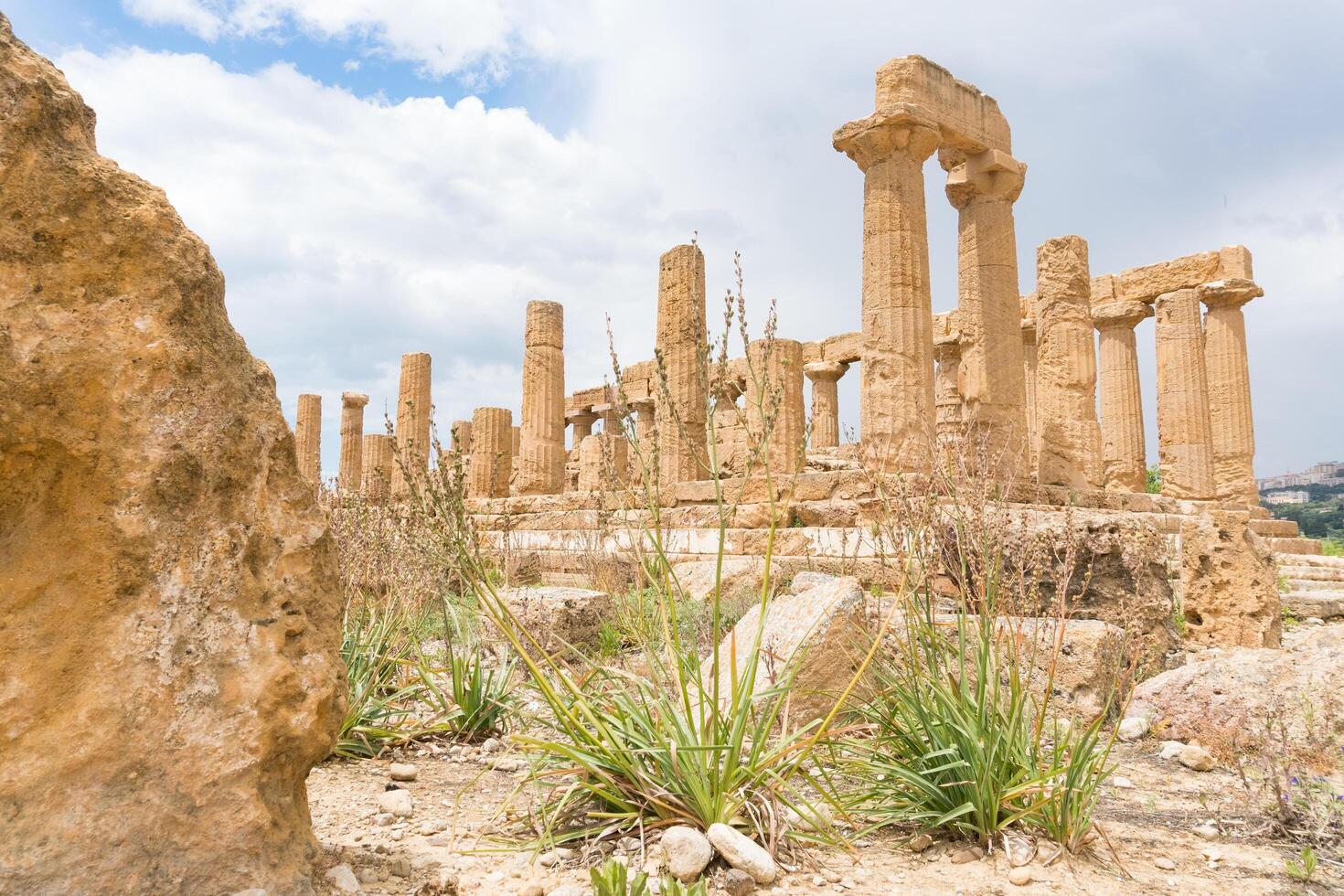 Agrigento, Italy-May 10, 2022-the imposing Greek Temple of Juno inside the Valle di Templi archaeological park near Agrigento during a sunny day photo