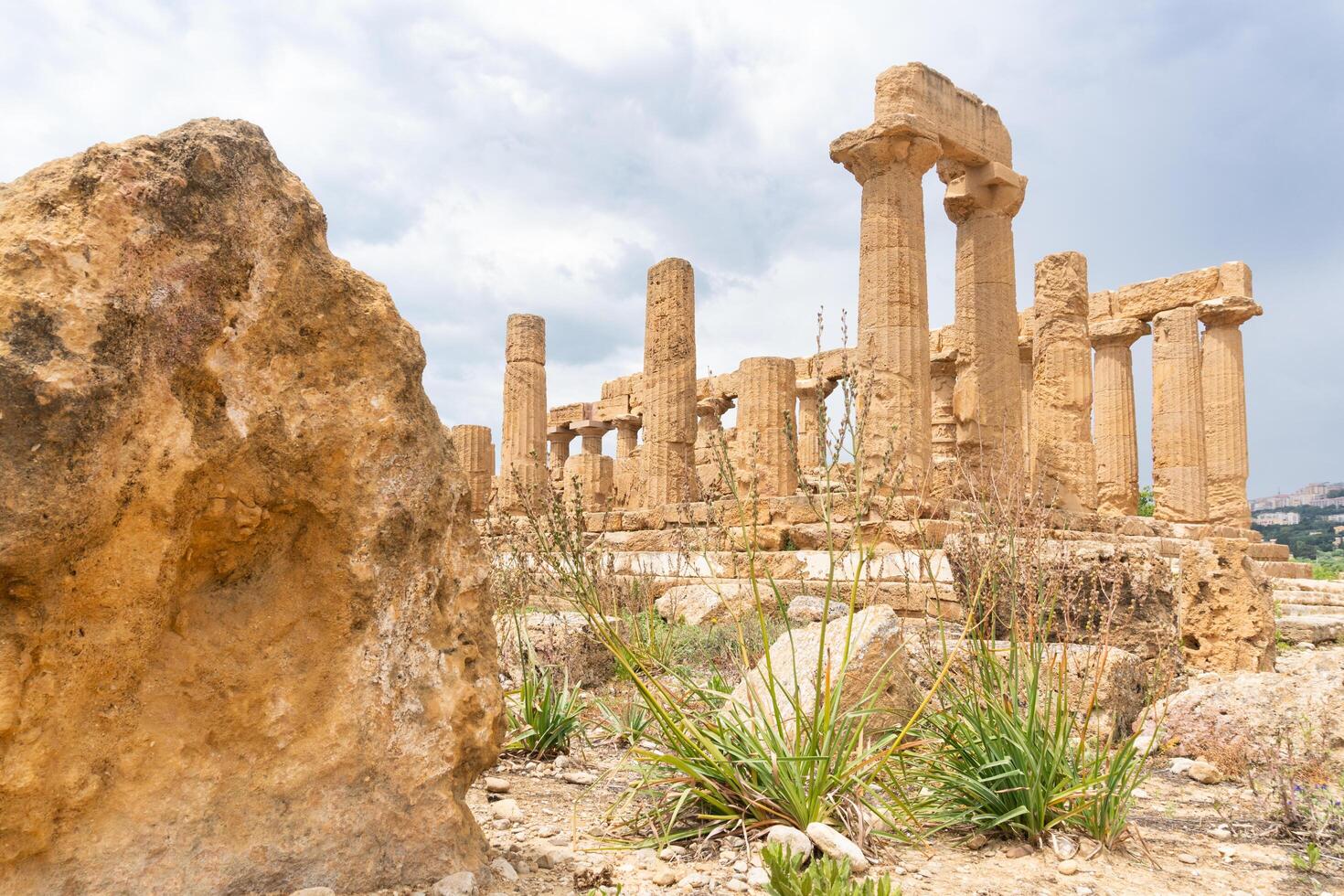 Agrigento, Italy-May 10, 2022-the imposing Greek Temple of Juno inside the Valle di Templi archaeological park near Agrigento during a sunny day photo