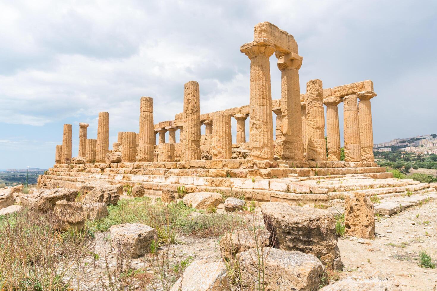Agrigento, Italy-May 10, 2022-the imposing Greek Temple of Juno inside the Valle di Templi archaeological park near Agrigento during a sunny day photo