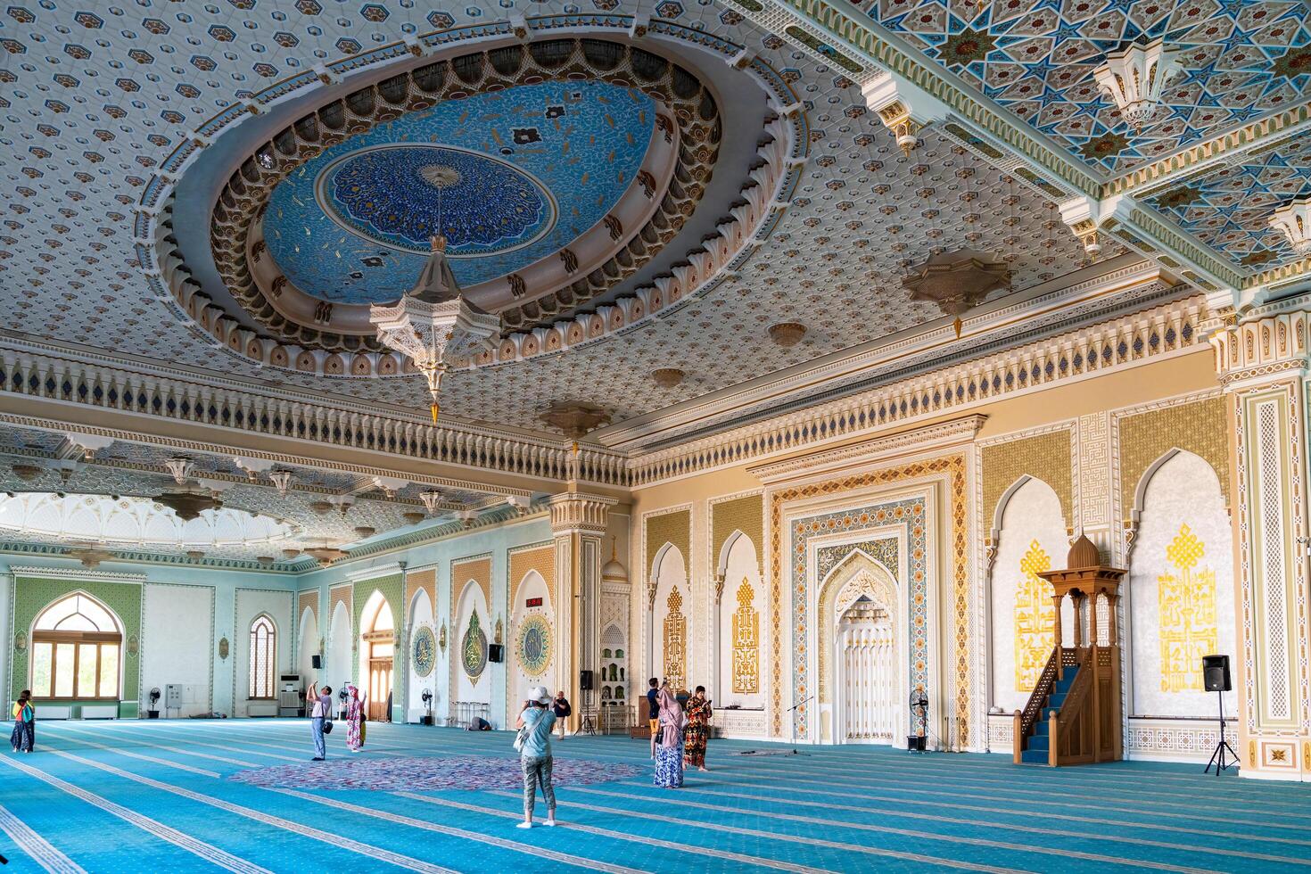 Tashkent, Uzbekistan-august 11, 2023-people visit the Khazrati Imam Mosque in the Hazrati Imam complex during a sunny day. photo