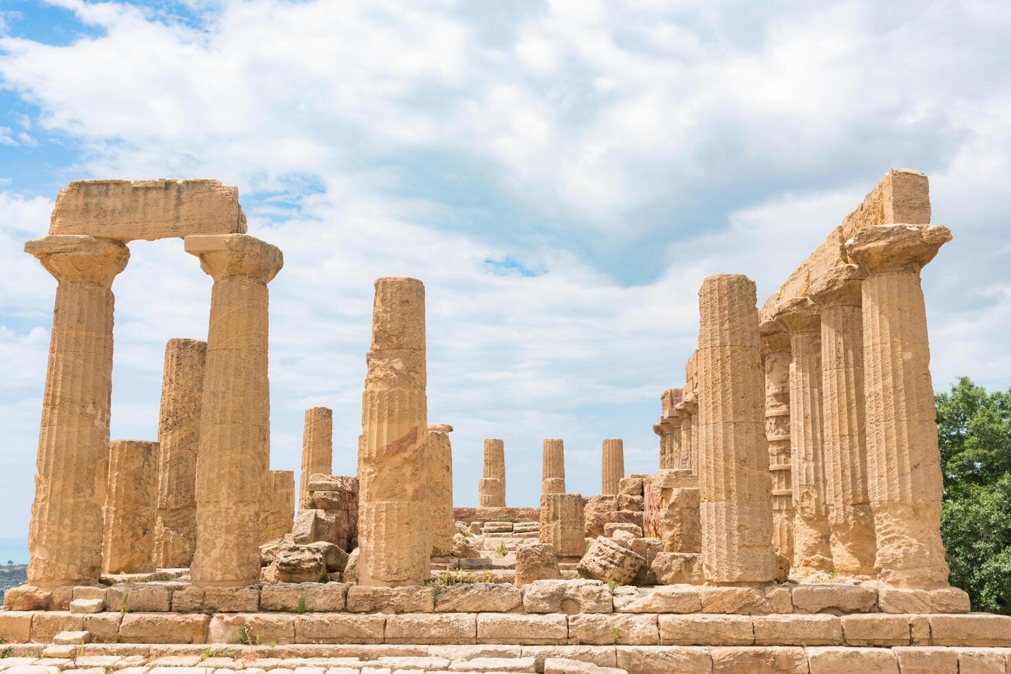 Agrigento, Italy-May 10, 2022-the imposing Greek Temple of Juno inside the Valle di Templi archaeological park near Agrigento during a sunny day photo