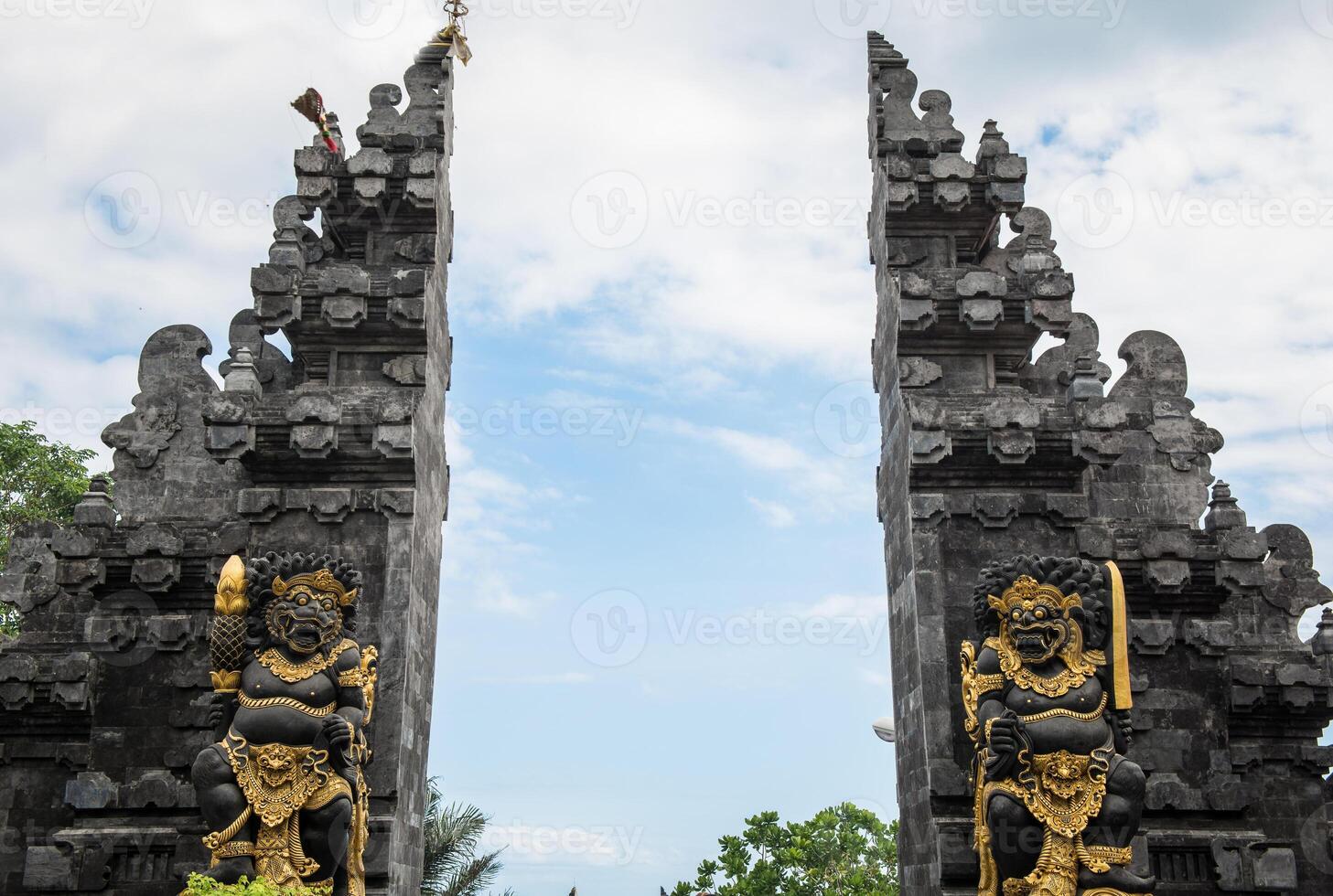 The traditional Balinese buildings called Candi bentar or split gateway, is a classical Javanese and Balinese gateway entrance commonly found at the entrance of religious compounds in Hinduism temple. photo