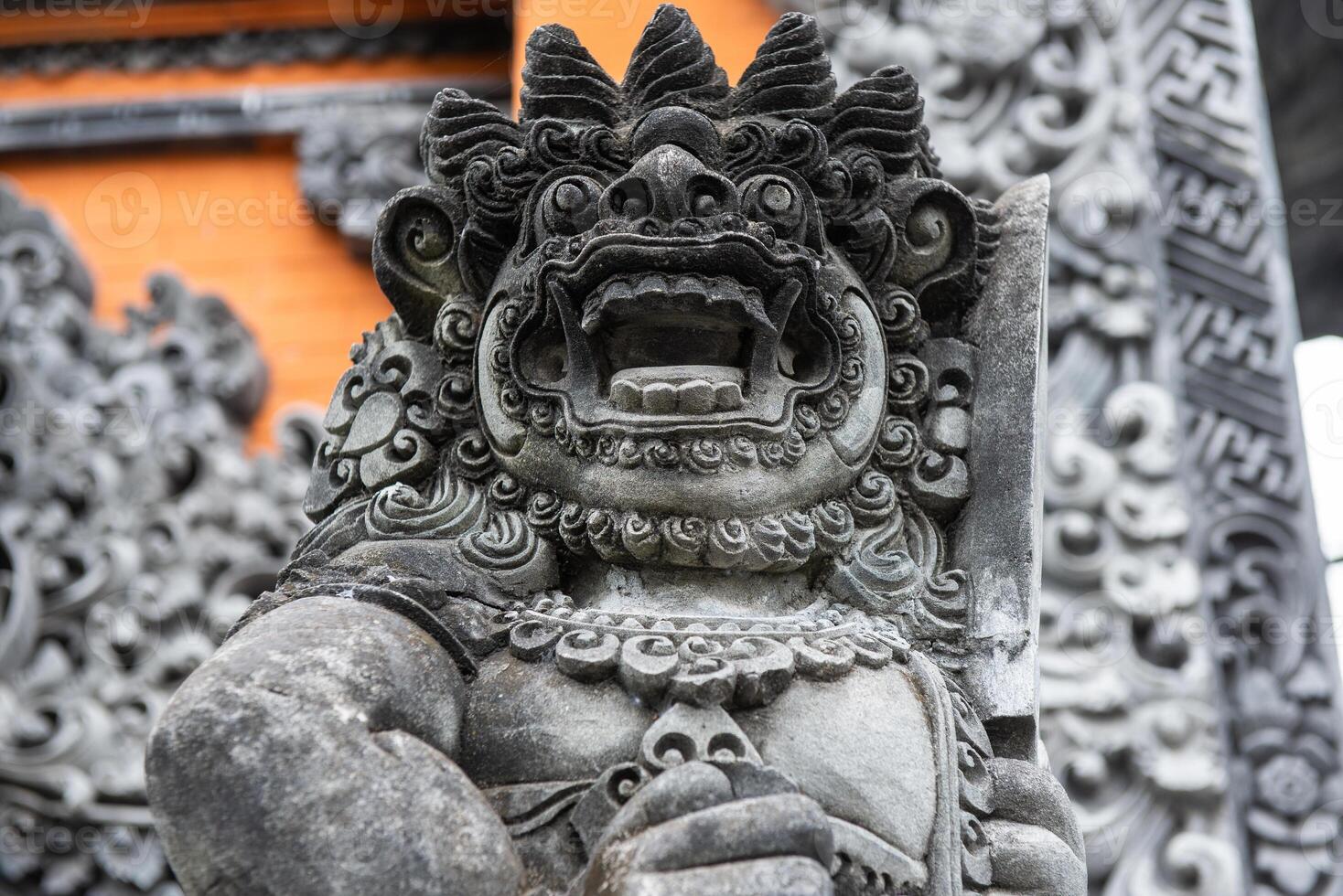 The traditional Balinese stone statue decorated in Pura Taman Ayun the royal temple of Mengwi empire in Badung Regency, Bali, Indonesia. photo
