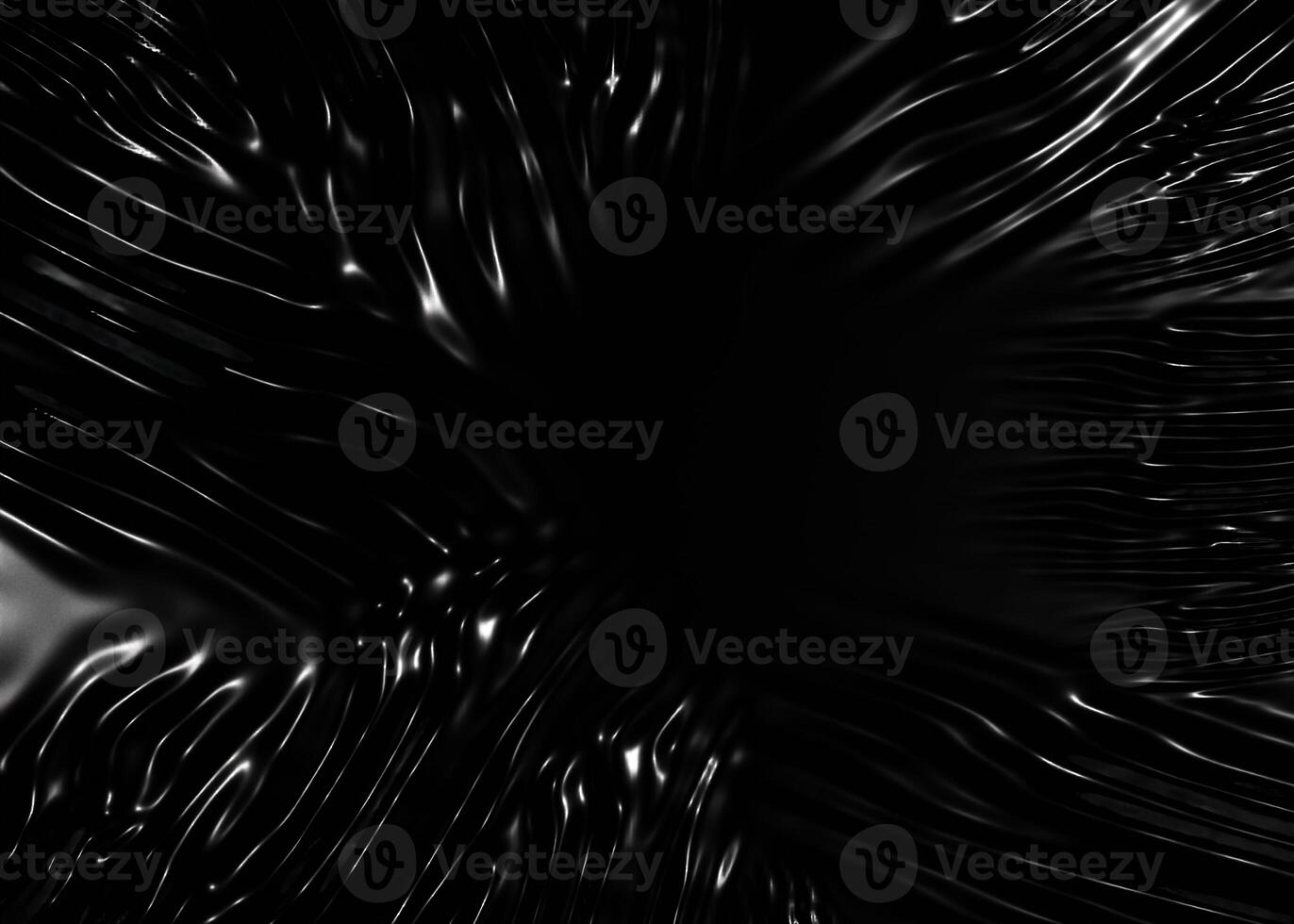 Wrinkled plastic wrap texture on a black background photo
