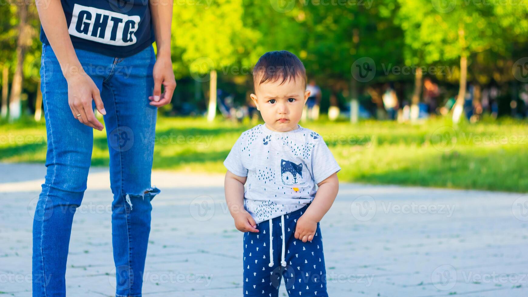 small boy with mother in the park photo