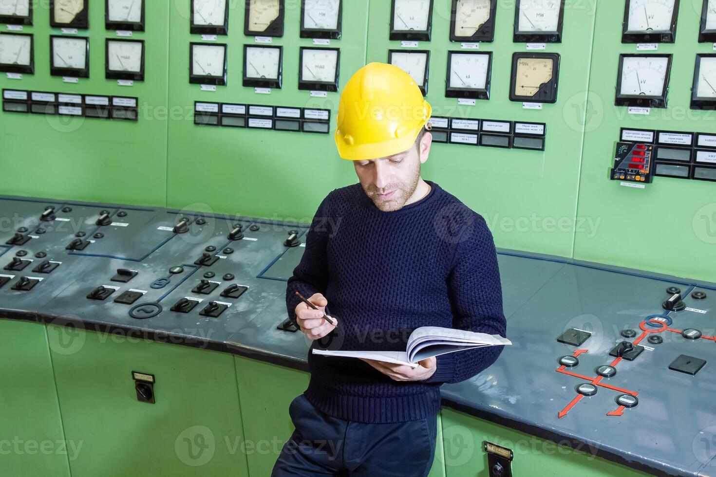 industrial worker at the work in factory photo