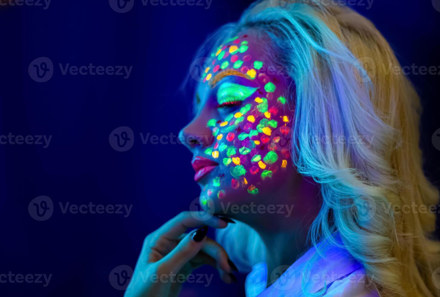 portrait of a woman with painted face, woman with uv makeup in studio, portrait of a woman in carnival mask, the woman is decorated in a ultraviolet powder photo