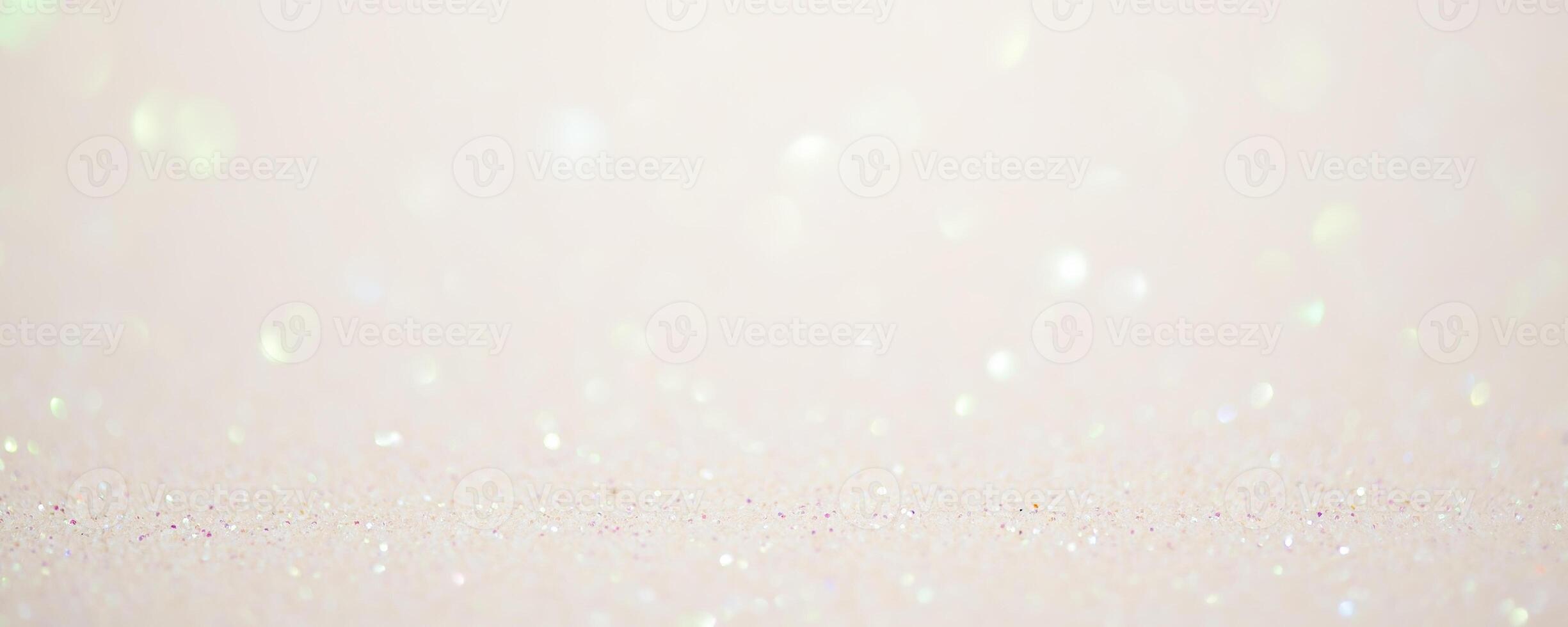 Glitter background in pastel delicate beige and pearl tones, de-focused, free space. photo