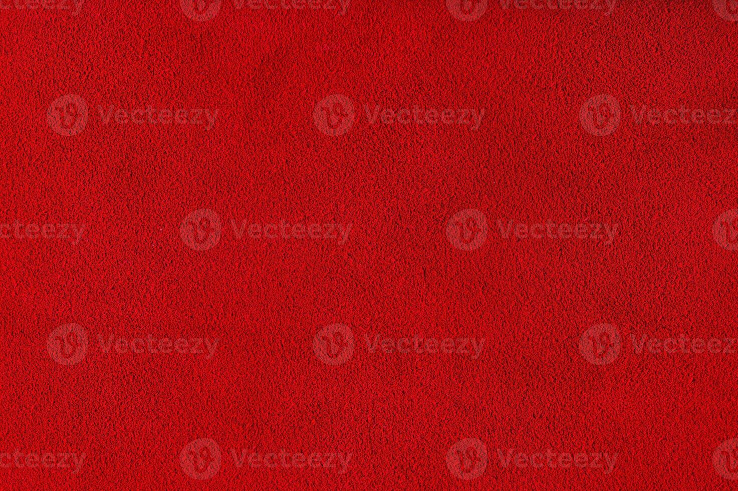 Red velvet background studio photo. Macro photo of natural red-dyed suede.
