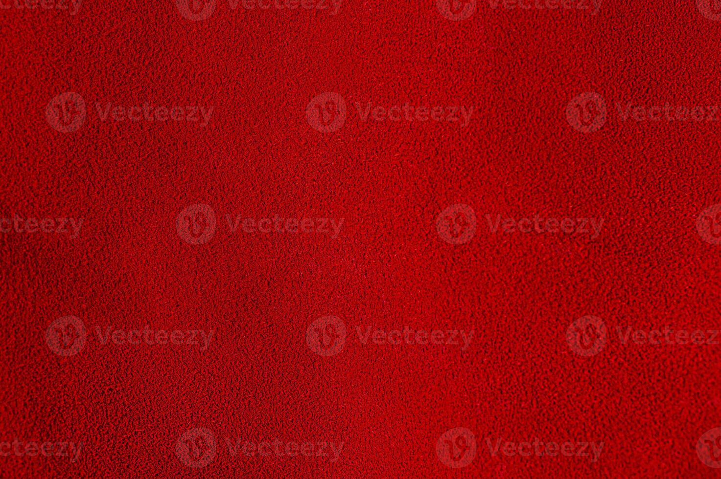Red suede as a background material for designers. Red velvet background. photo