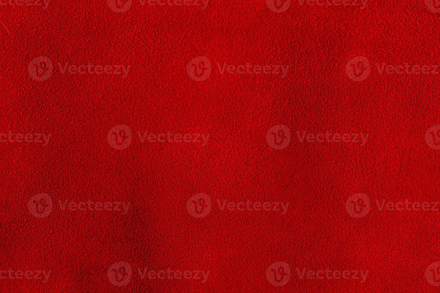 The background is red velvet. Macro photo of natural red suede. Texture of suede leather.