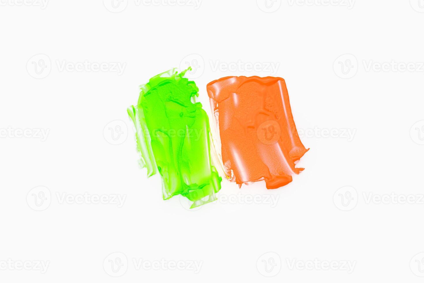 Green orange color paint splotches on white background photo