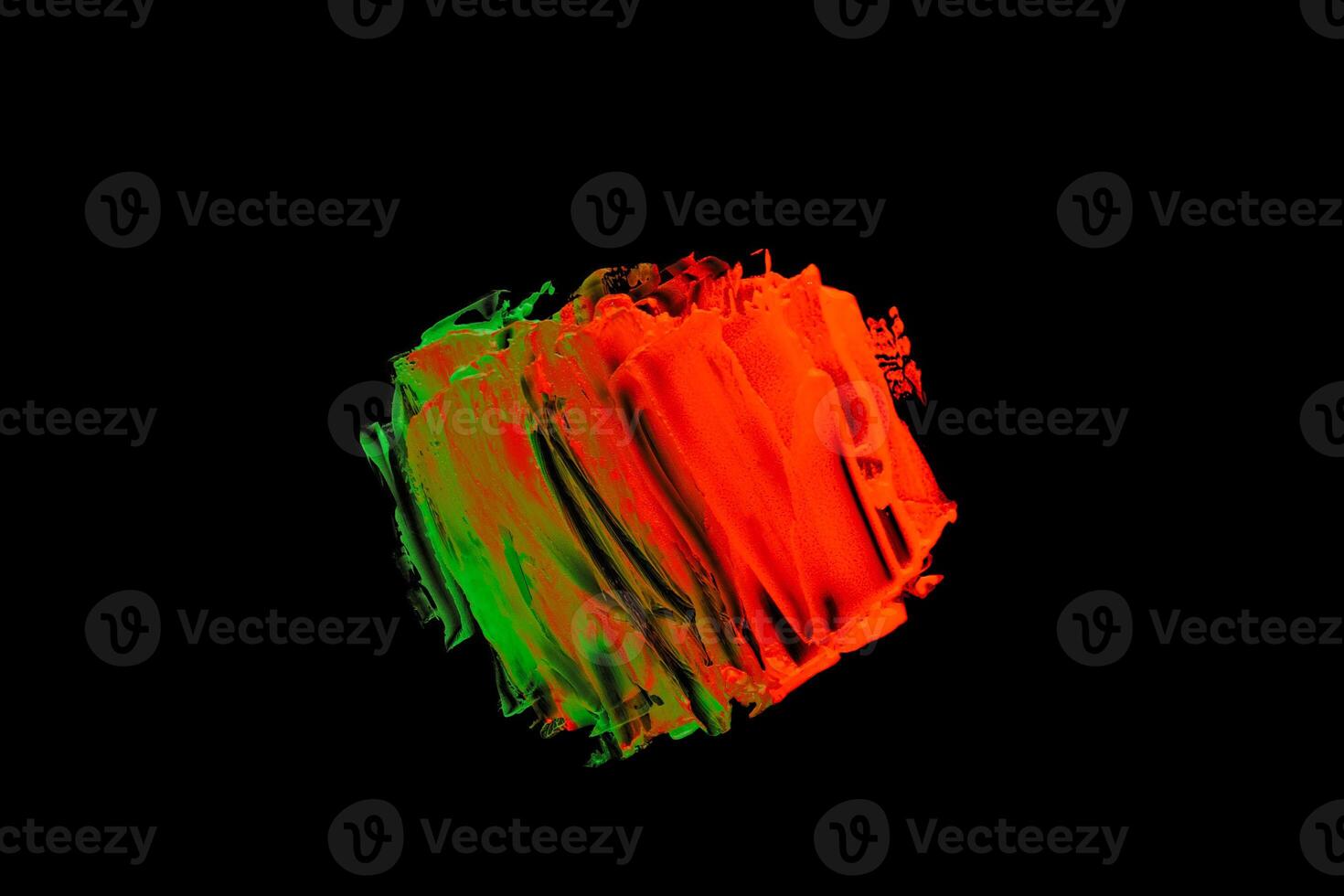 Green orange color paint splotches on black background photo