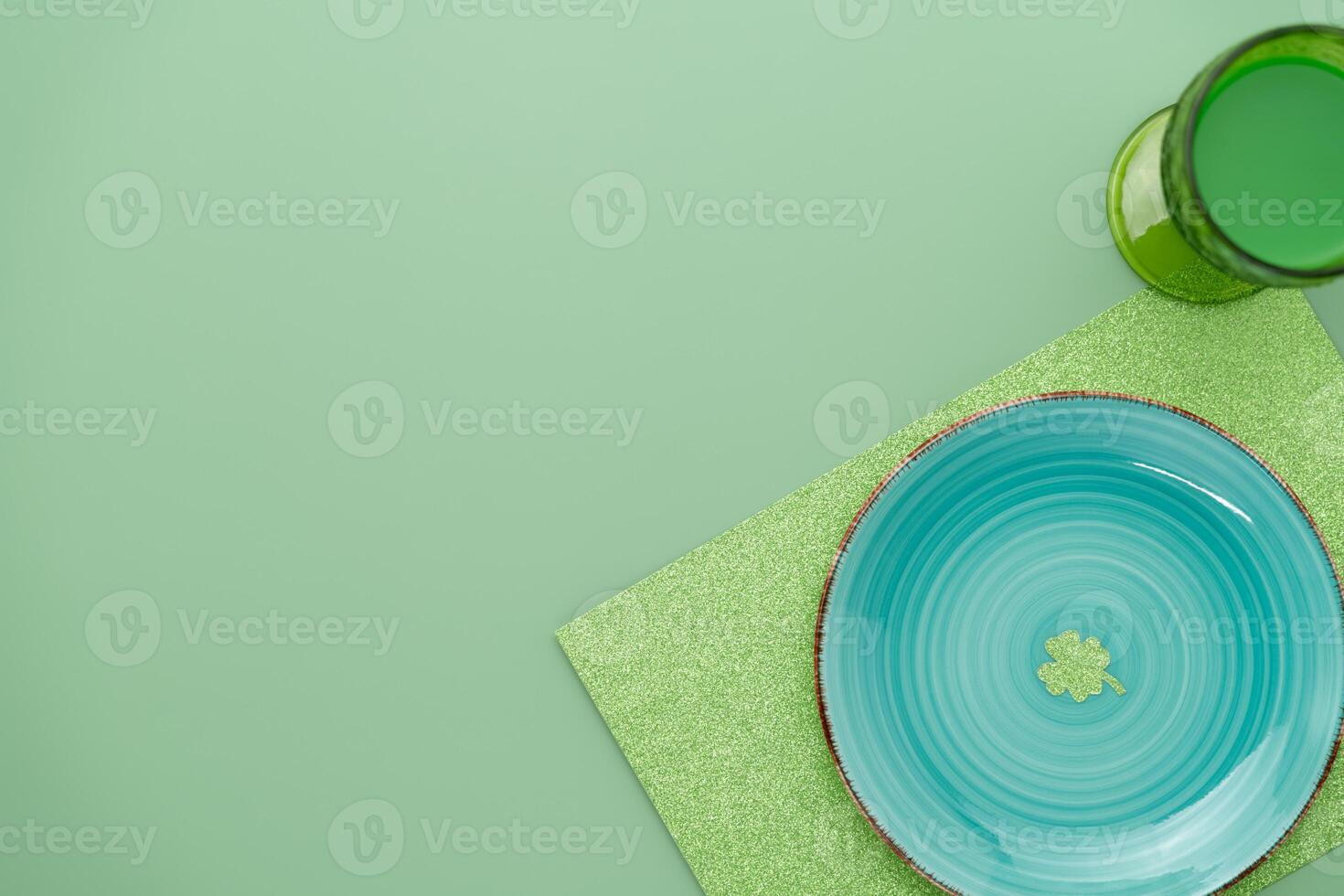 Green place setting for St Patricks dinner with a clover photo