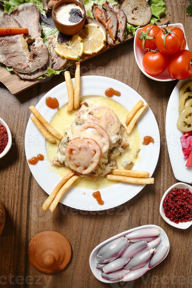 Wooden Table Displaying a Variety of Deliciously Prepared Food photo