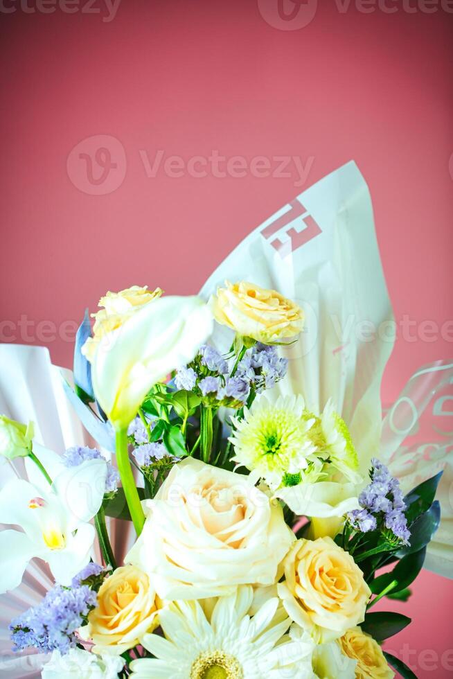 White and Yellow Flower Bouquet in Vase photo