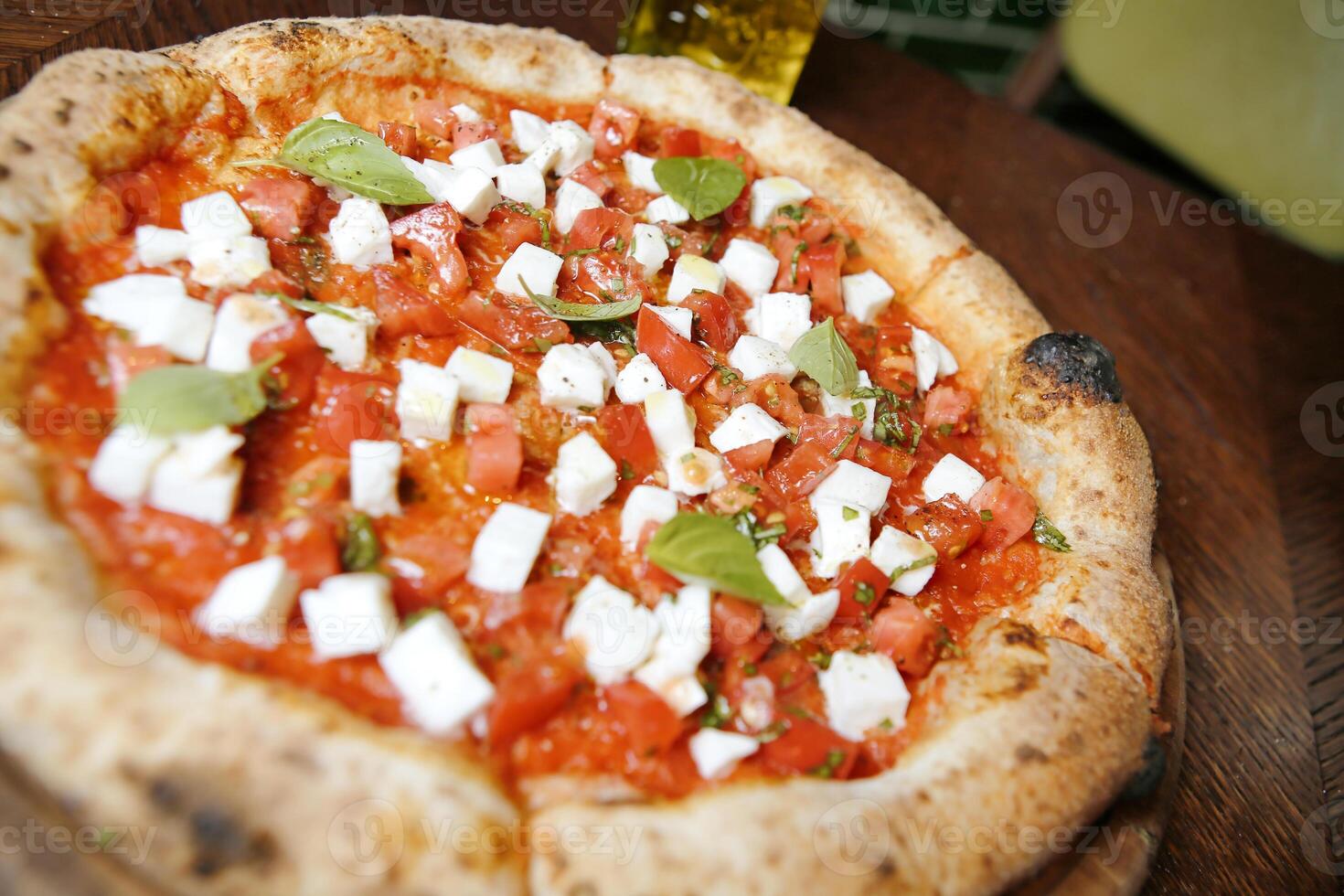 Close-Up of Delicious Pizza on Table photo