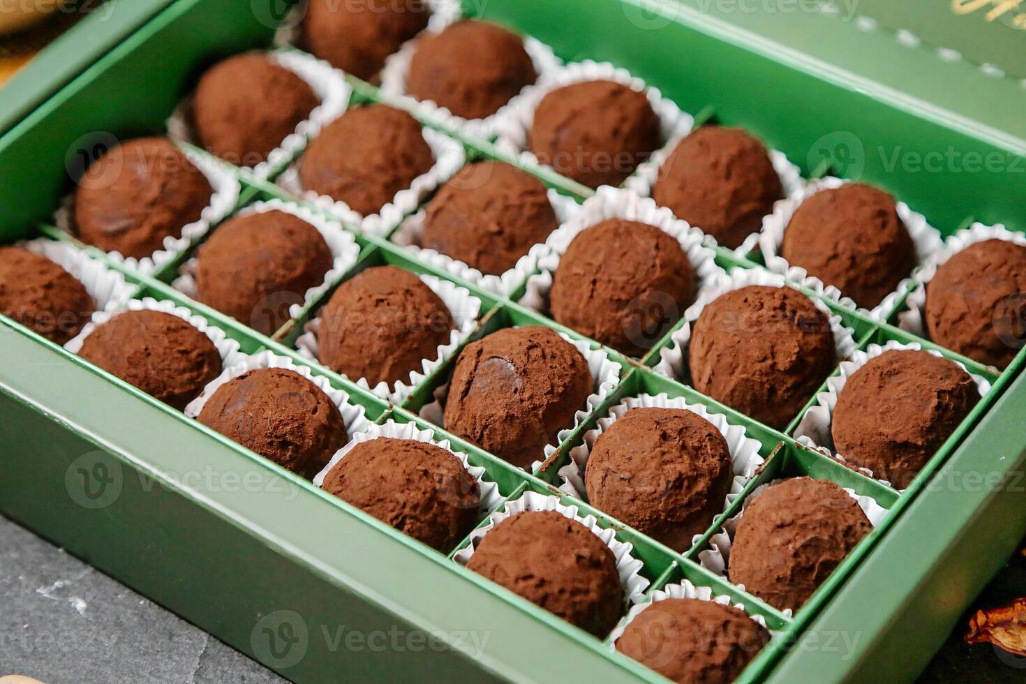Box of Chocolate Truffles on Table photo