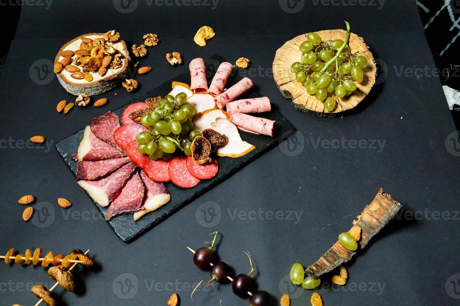Assorted Meats, Cheeses, Grapes, and Nuts Platter photo