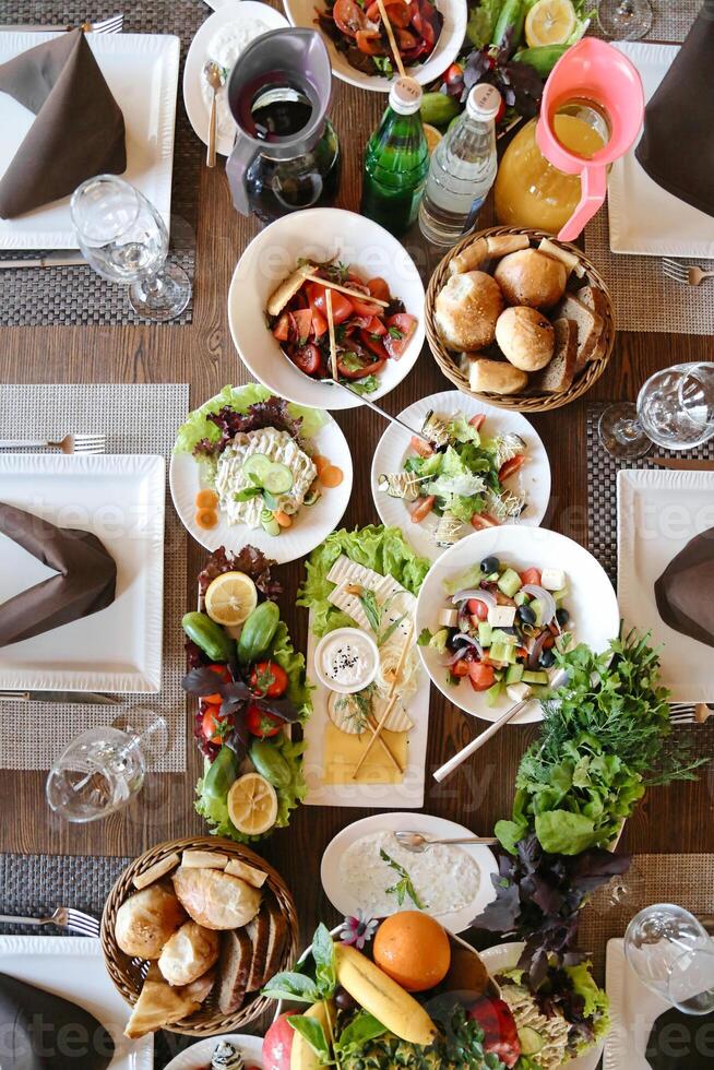 Abundance on Display Table Loaded With Plates of Food photo